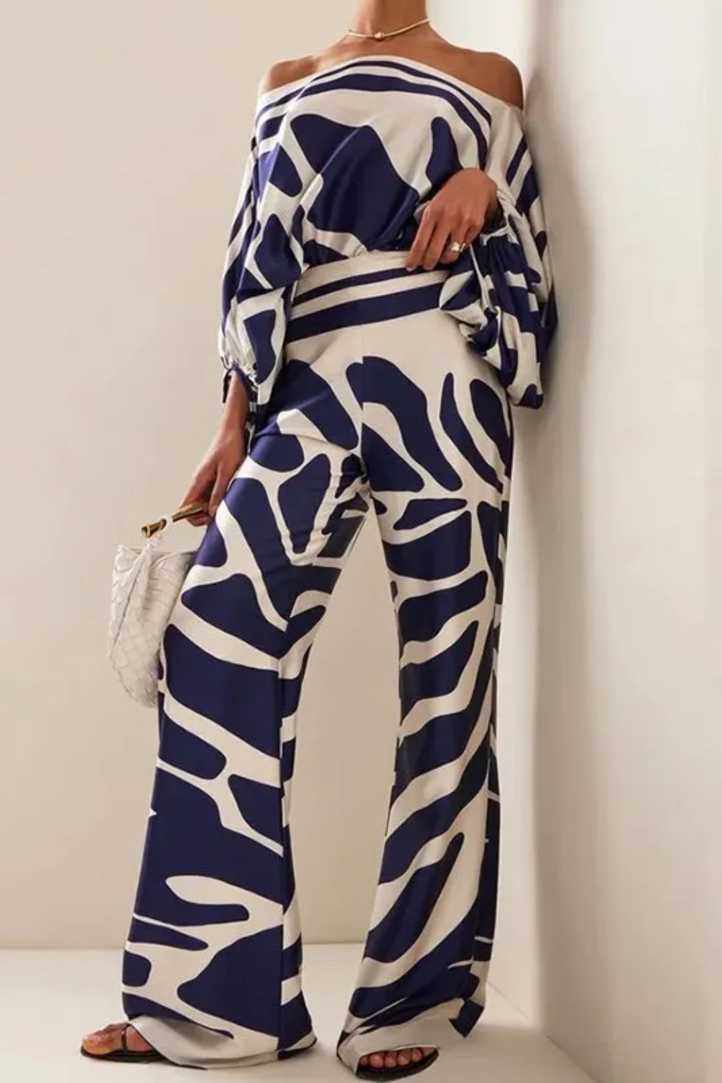 Graceful Off-Shoulder Wide-Leg Jumpsuit – Abstract Print Summer Style