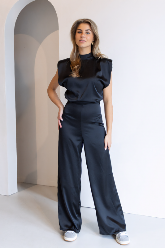 Sleeveless Wide-Leg Jumpsuit – Modern High-Neck Cut & Refined Open-Back Detail